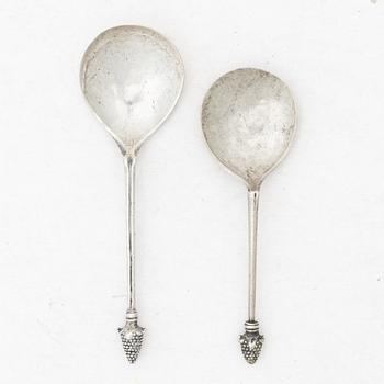 Two unmarked silver spoons, likely 18th century.