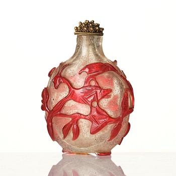 A red overlay Beijing glass snuff bottle, Qing dynasty.