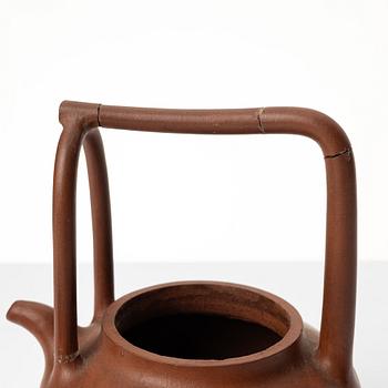 Two Chinese yixing teapots, early 1900s and 1980s.