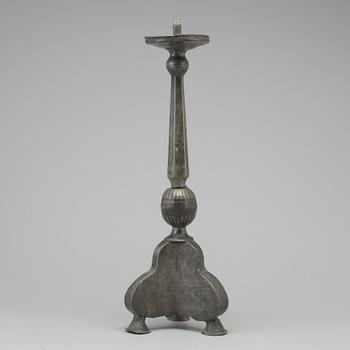 A 17th century pewter candlestick.