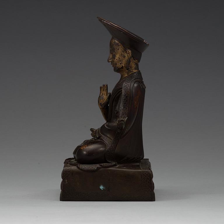 A Sino-Tibetan bronze figure of a Lama, early 20th Century.