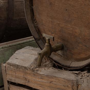 A pair of oak wine casks on stands, early 20th century.