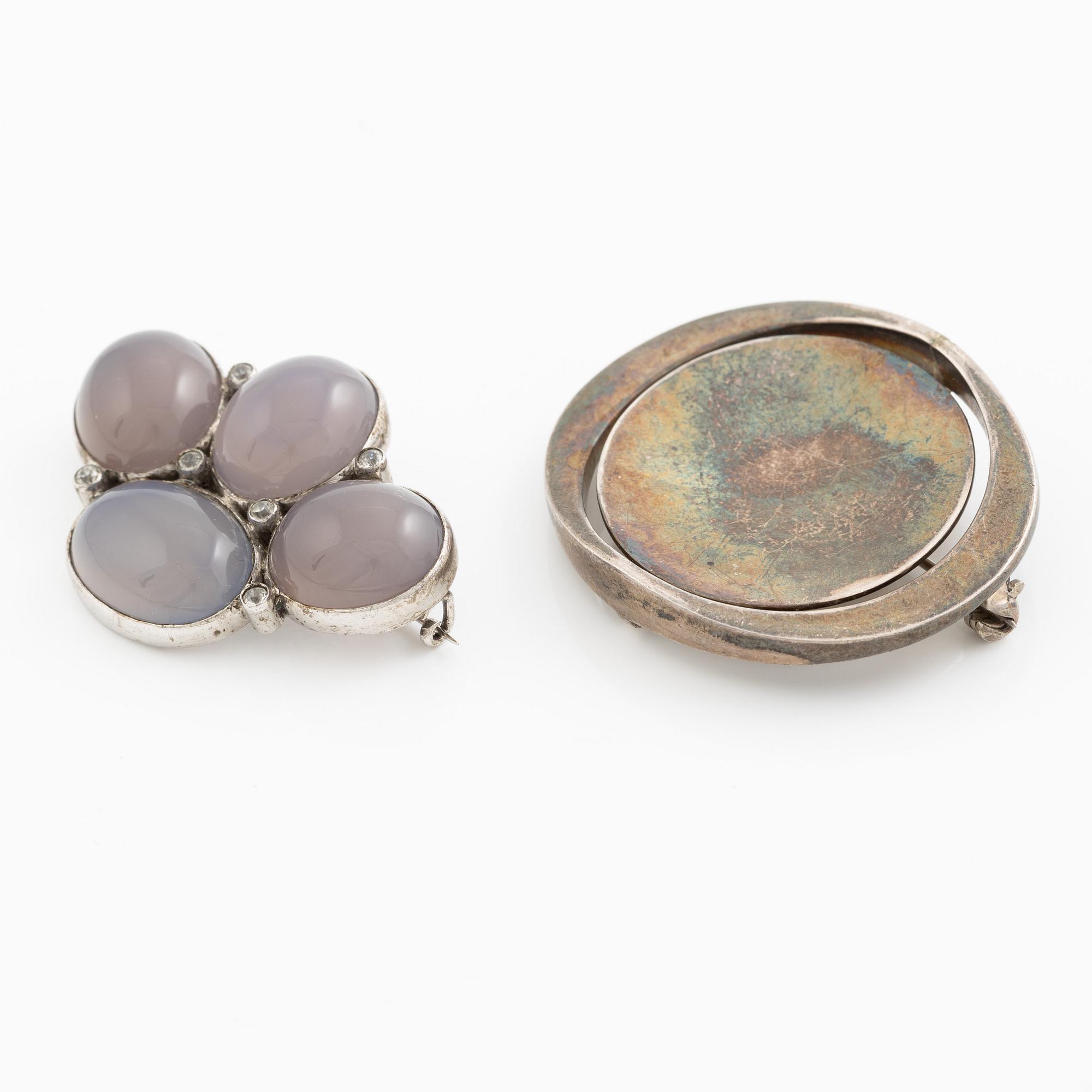 Two brooches, silver with chalcedony and white stones, SE Högberg, Gothenburg 1964 and H Strömdahl, Stockholm.