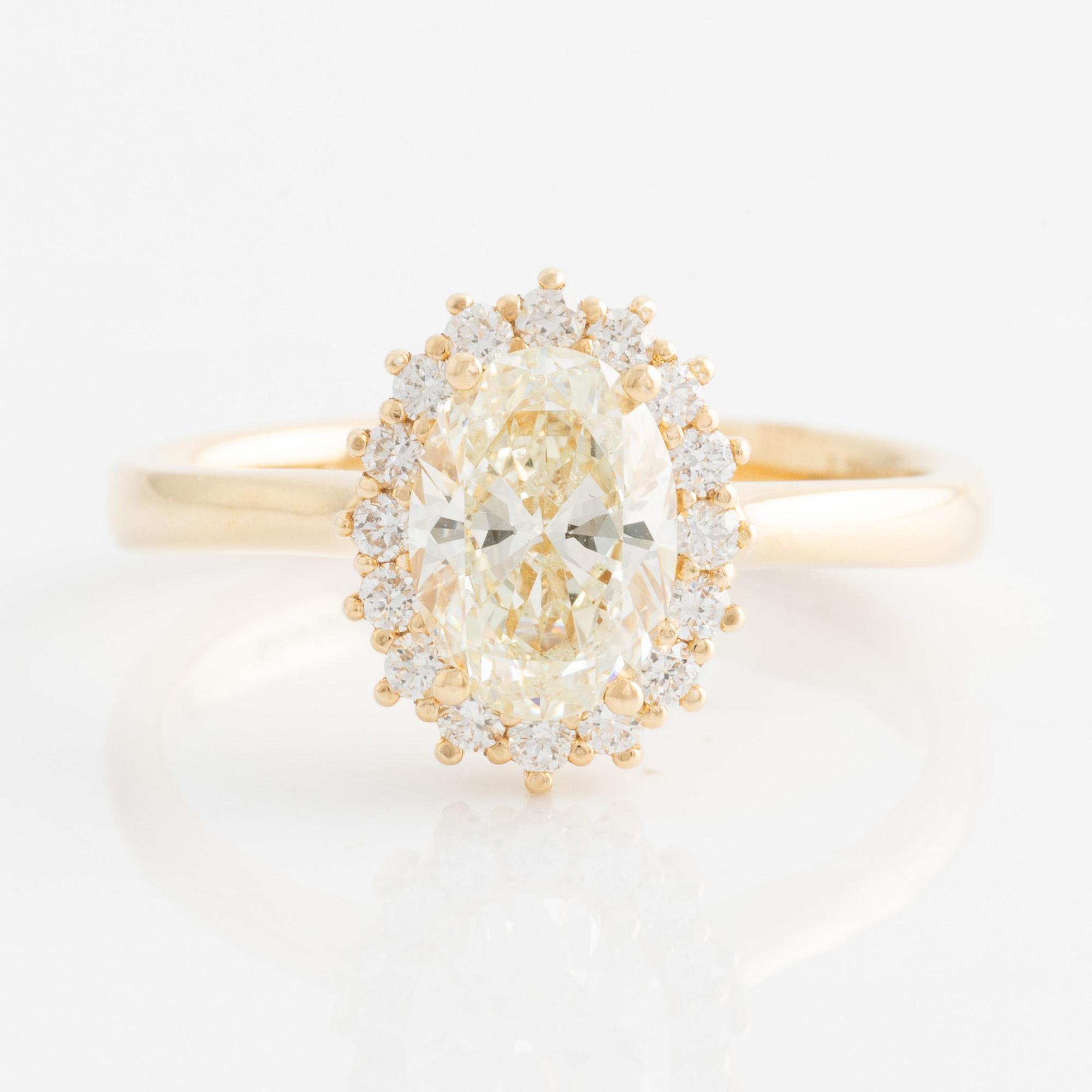 Ring with oval diamond and brilliant-cut diamonds. Accompanied by GIA report.