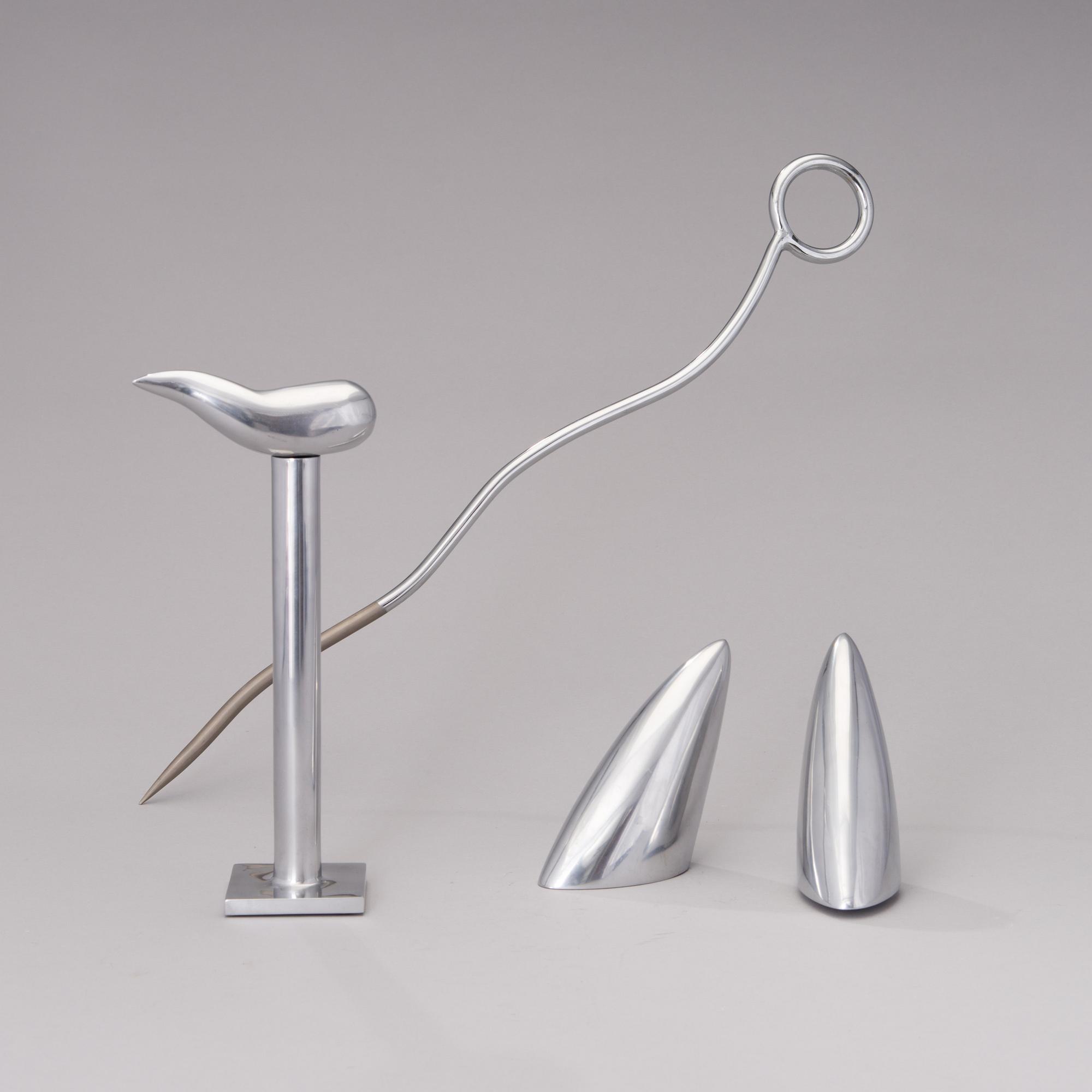 A pair of Chab Wellington coat hooks, a Smoki Christiani cork screw and a Picfeu fireplace poker. Late 1980s.