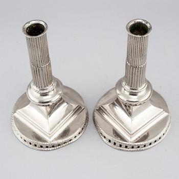 A pair of candlesticks in silver-plated pewter, by Gottlob Friedrich Baumann in Hudiksvall, 1794 and 1799.