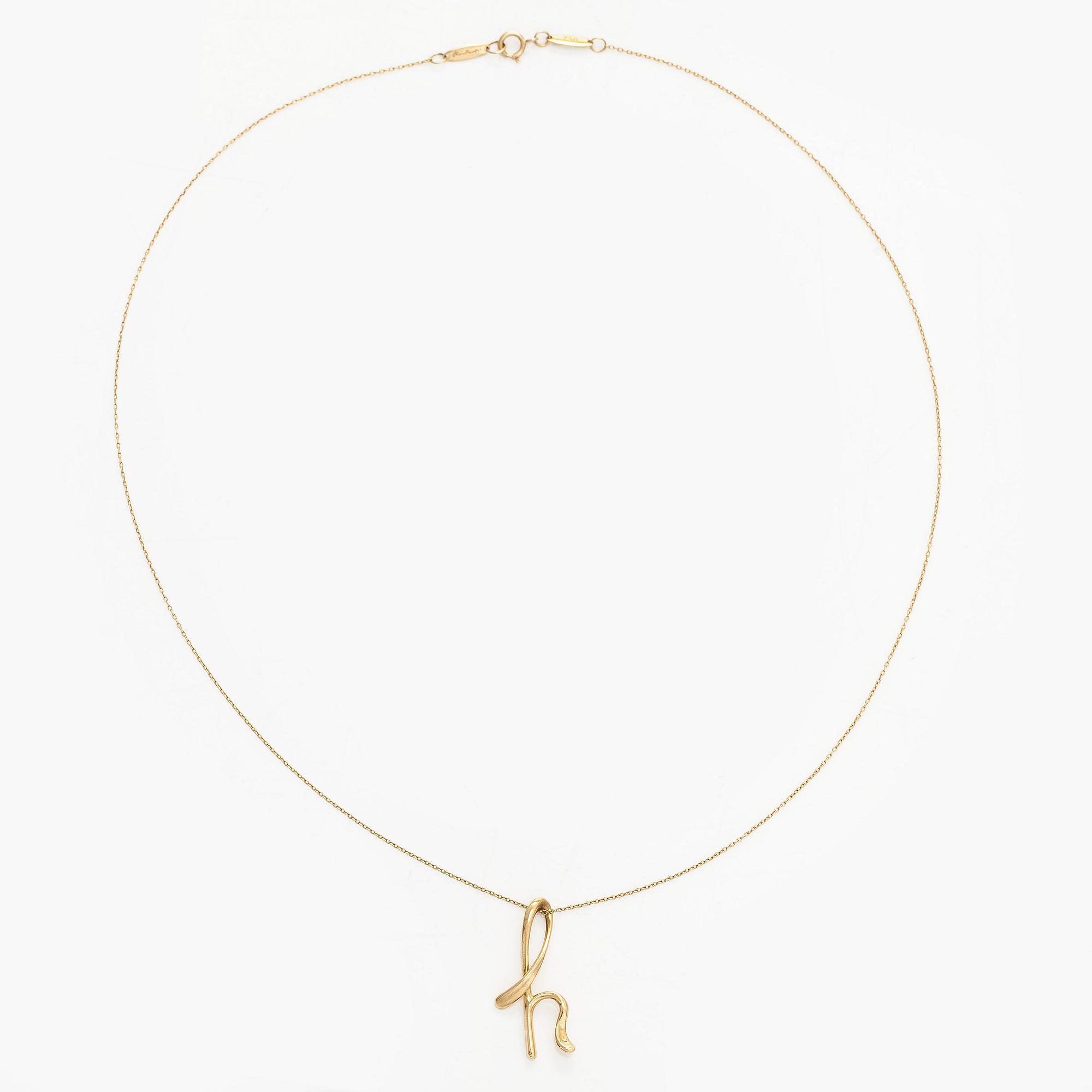 Tiffany & Co, Elsa Peretti, an 18K gold 'Alphabet Pendant' necklace.