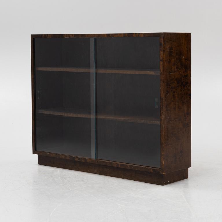 A birch book case with glass sliding doors, first part of the 20th Century.
