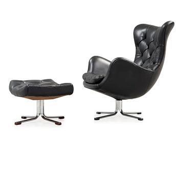 30. A Gustav Axel Berg 'Status' black leather easy chair with ottoman, Bröderna Andersson 1960's-70's.