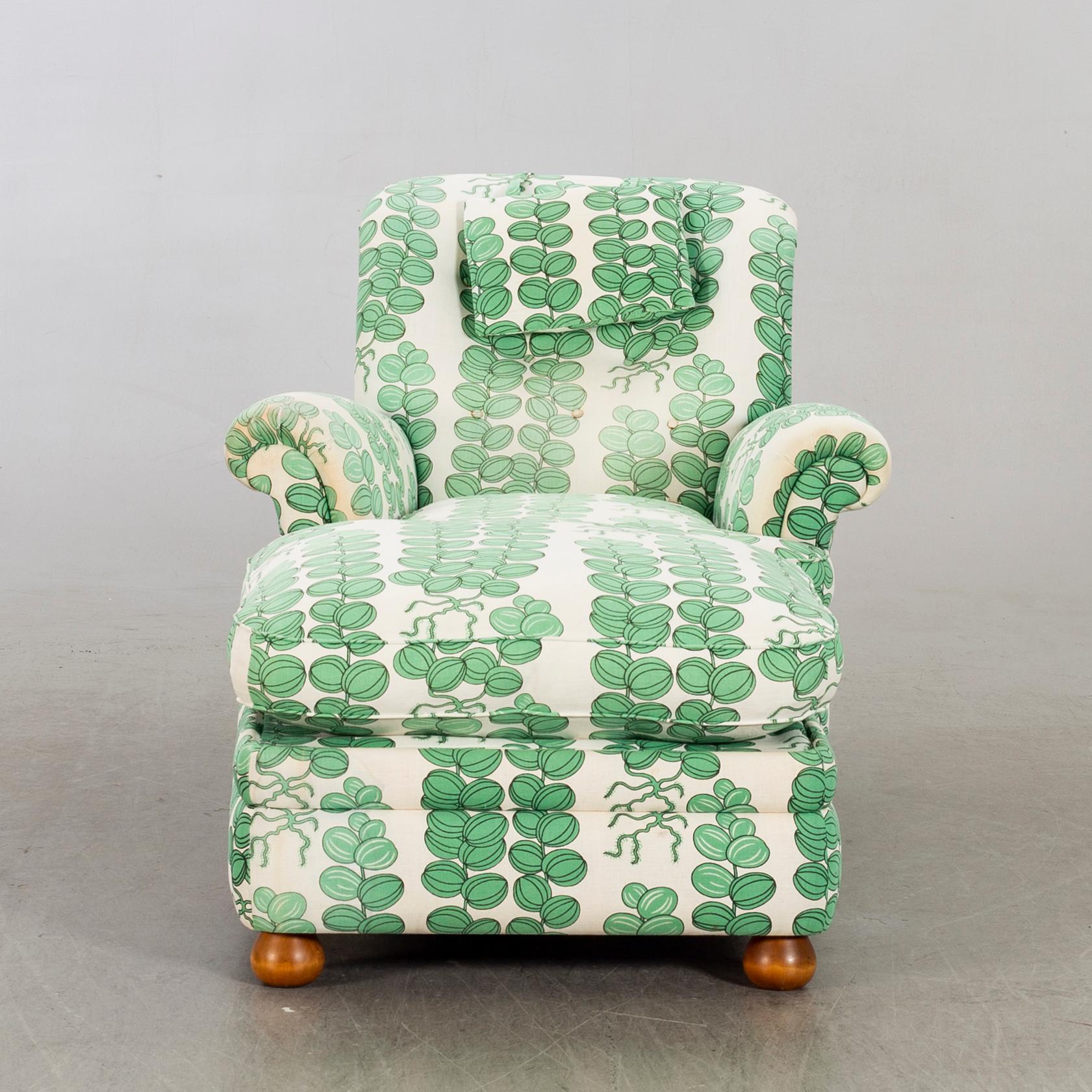 A model 336 easy chair with stool by Josef Frank for Firma Svenskt Tenn, Sweden.