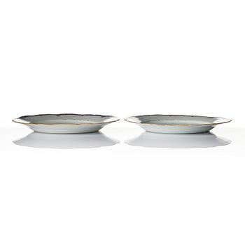 A pair of 'Chinese Export' armorial dinner plates, Qing dynasty, 1790's.