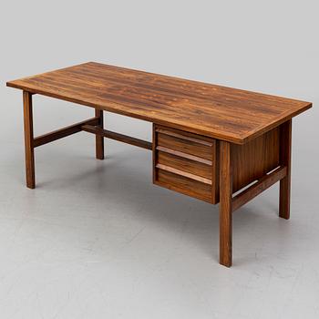 SVEND AAGE MADSEN, a Danish rosewood veneered desk, Sigurd Hansen, 1960's.