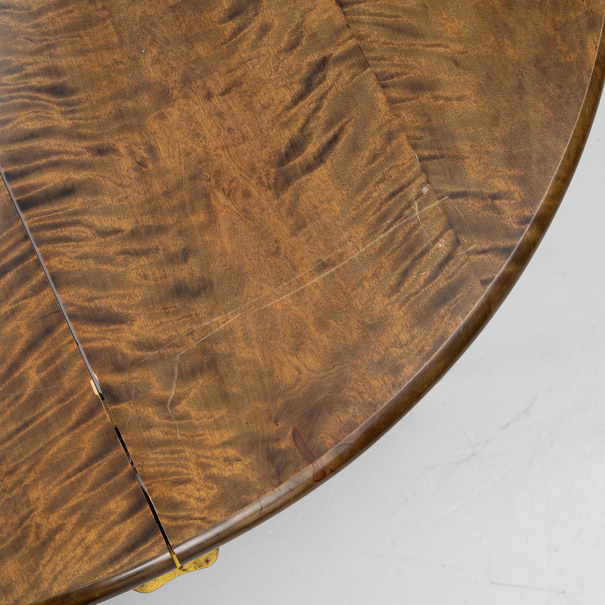 Dining table, circa 1900.