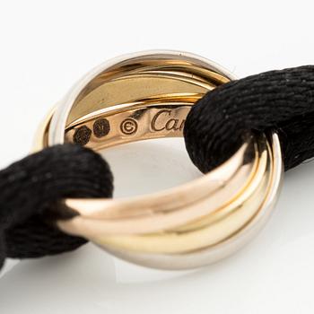 A Cartier "Trinity" bracelet, 18K three colour gold and textile.
