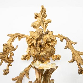 A pair of Louis XV style appliqués, late 19th century.