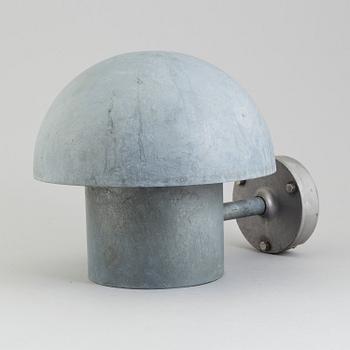 A wall lamp by Louis Poulsen, Denmark.