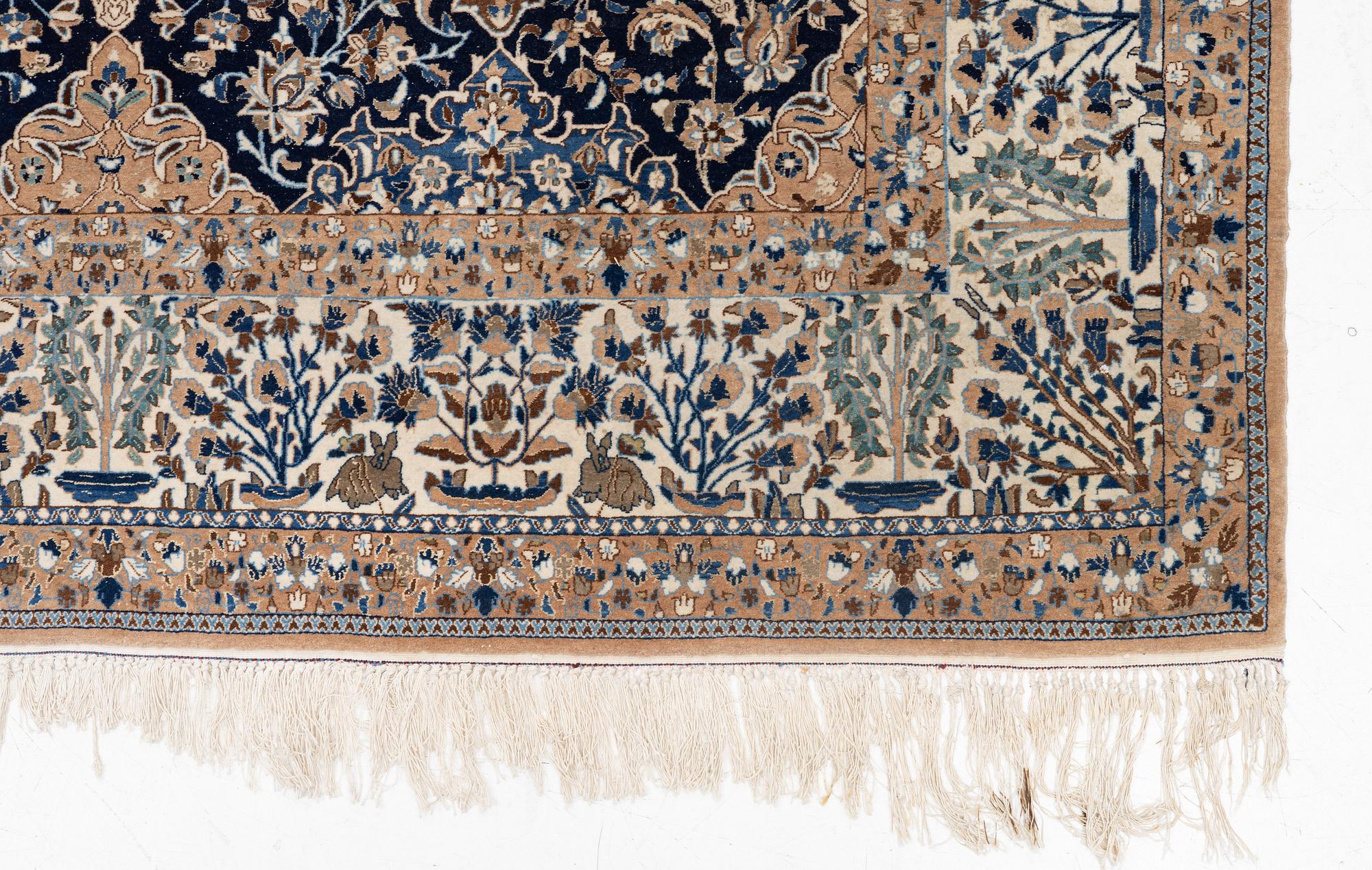 A semi-antique Nain carpet, part-silk, c. 261 x 175 cm.