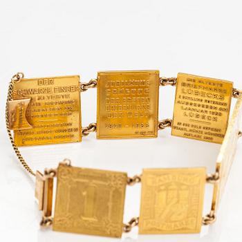 A bracelet with post stamps made of 900 gold..