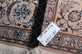 A Nain carpet, part silk, 6 laa, c. 283 x 180 cm.