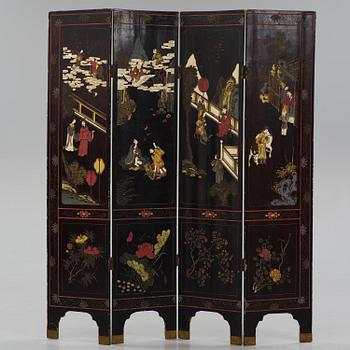 A Chinese four panel lacquer folding screen, first part of the 20th century.