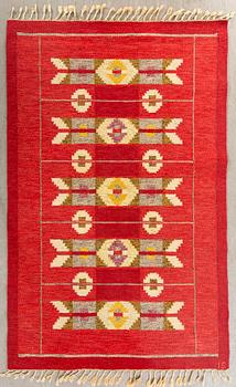 A Swedish flat weave rug signed IS ca 240 x 169 cm.