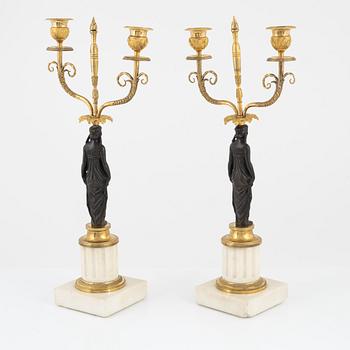 A pair of French Louis XVI two-light marble and ormolu candelabra, late 18th century.