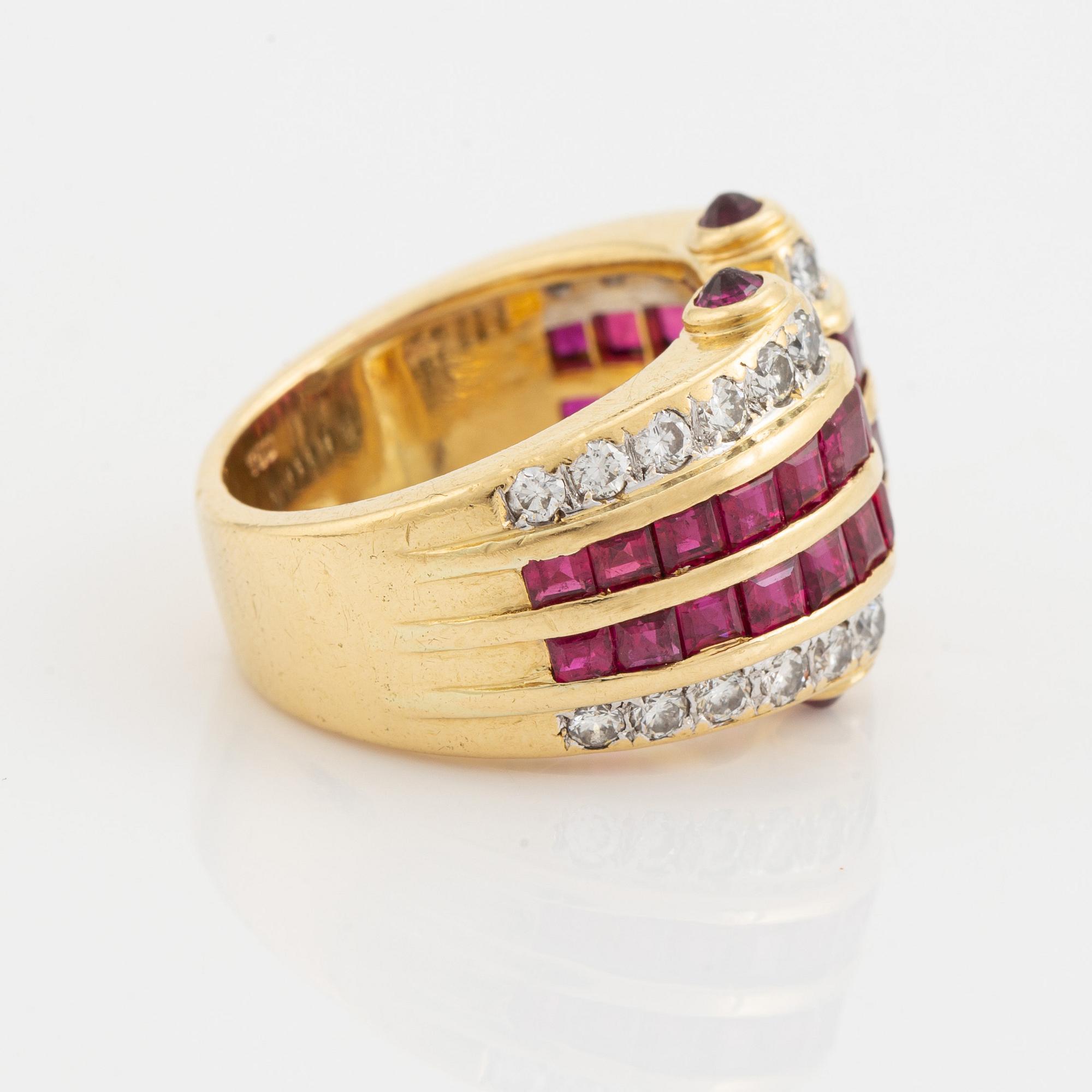 Step cut ruby and brilliant cut diamond ring.