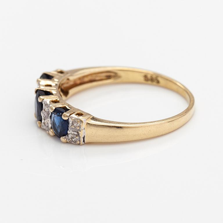 A 14K gold ring with diamonds ca. 0.05 ct and sapphires. Finnish import marks 1990.