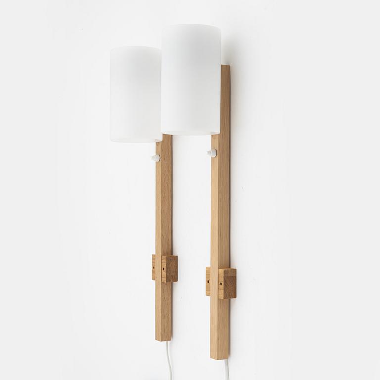 A pair of oak and acrylic wall lights, Luxus, Vittsjö.