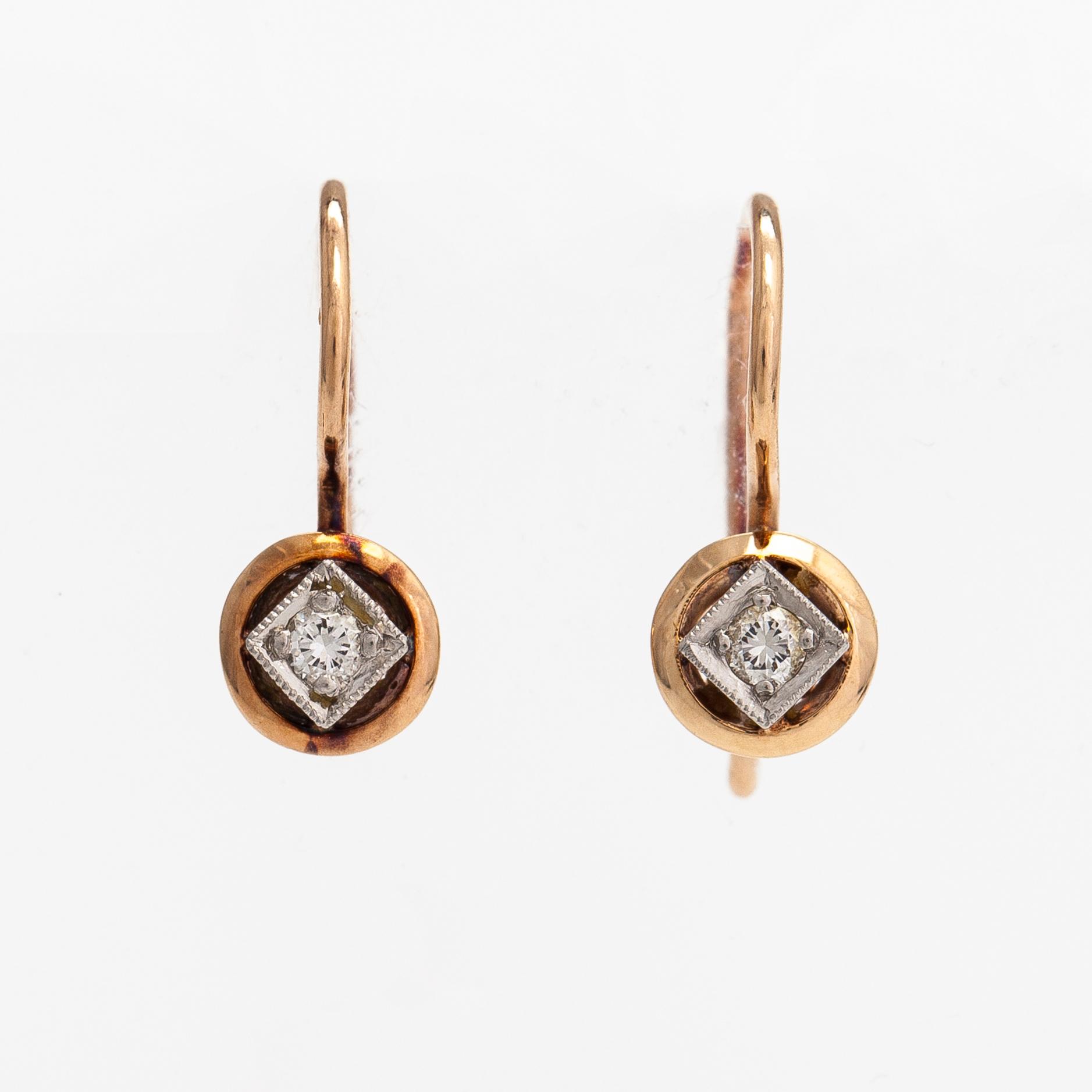 A pair of 14K gold earrings with diamonds ca. 0.06 ct tot. Finland.
