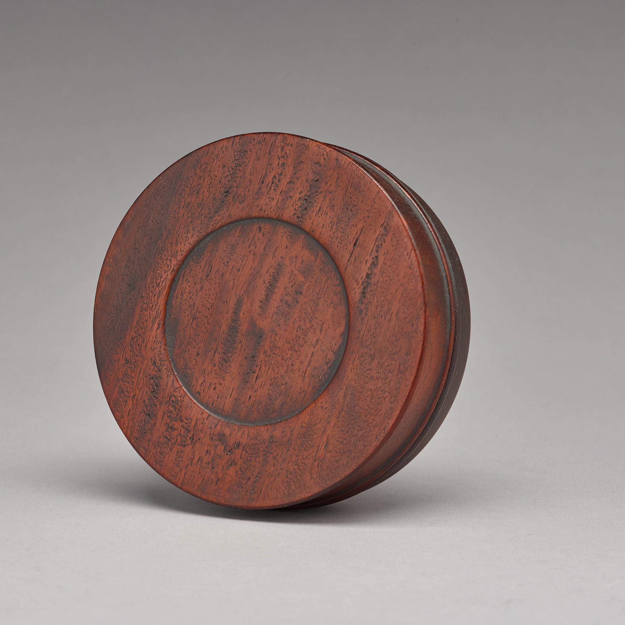 A Chinese wooden box with cover.
