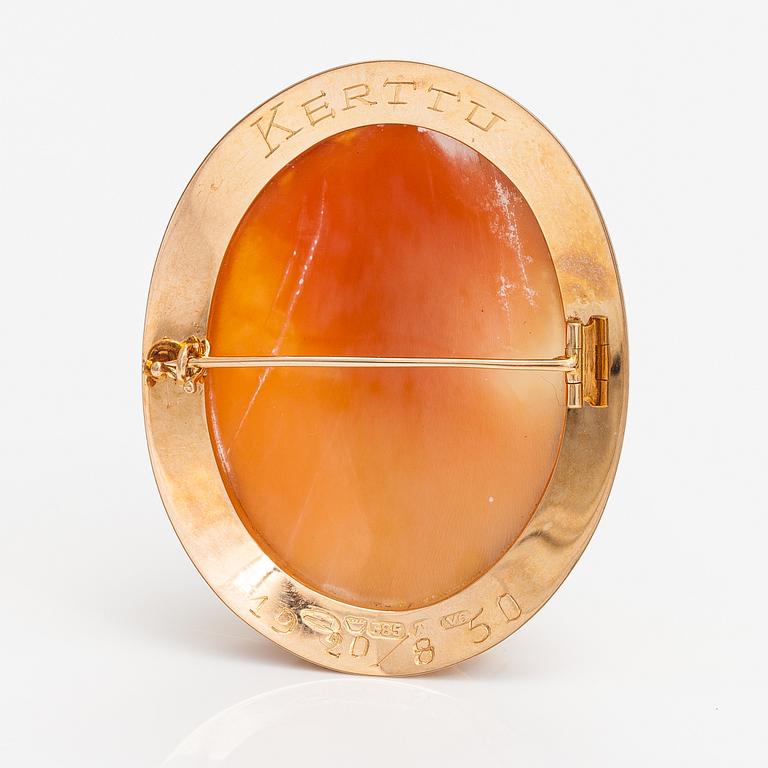 Two brooches and a ring, 14K and 18K gold and sea shell cameos.