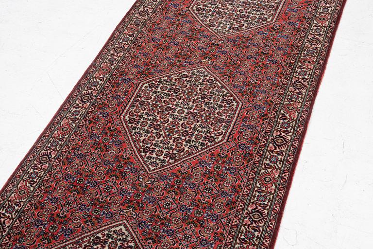 A runner carpet, possibly Birjand, c. 412 x 90 cm.