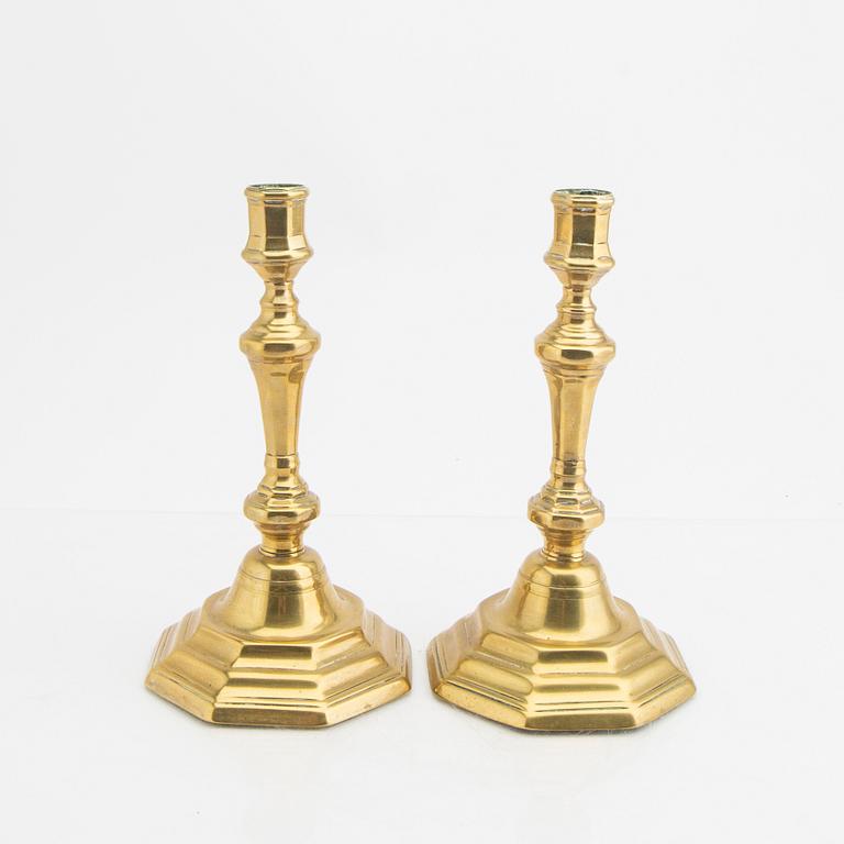 A pair of 18th century brass candle sticks.
