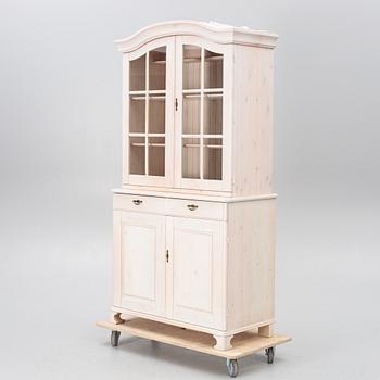 A display cabinet, late 20th Century/21st Century.