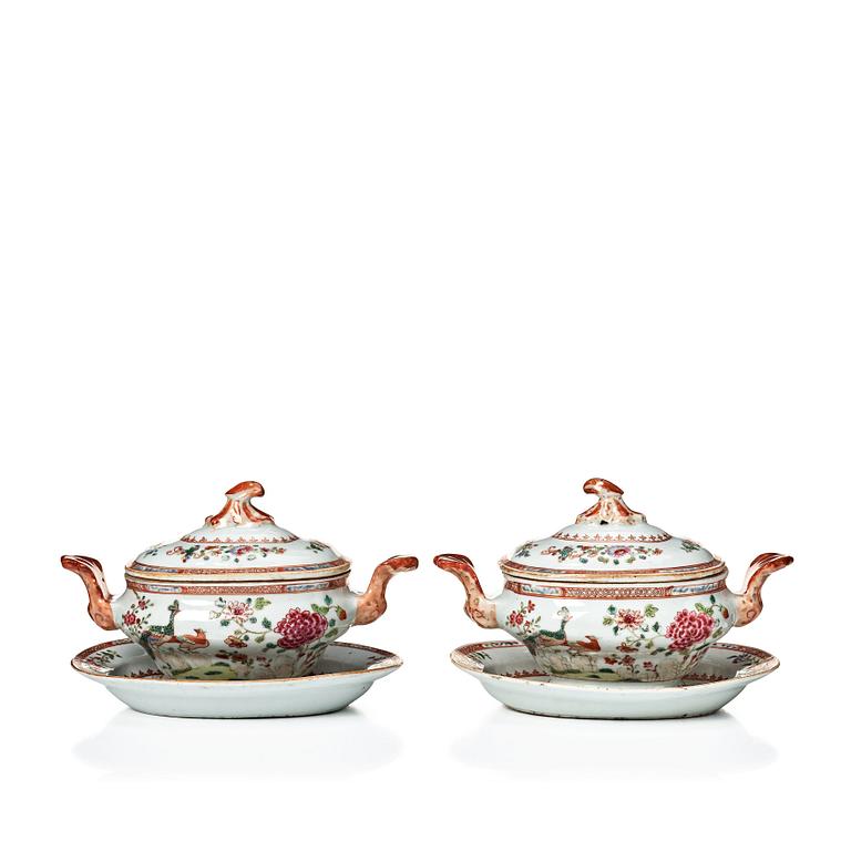 Two famille rose 'double peacock' butter tureens with covers and stands, Qing dynasty, Qianlong (1736-95).