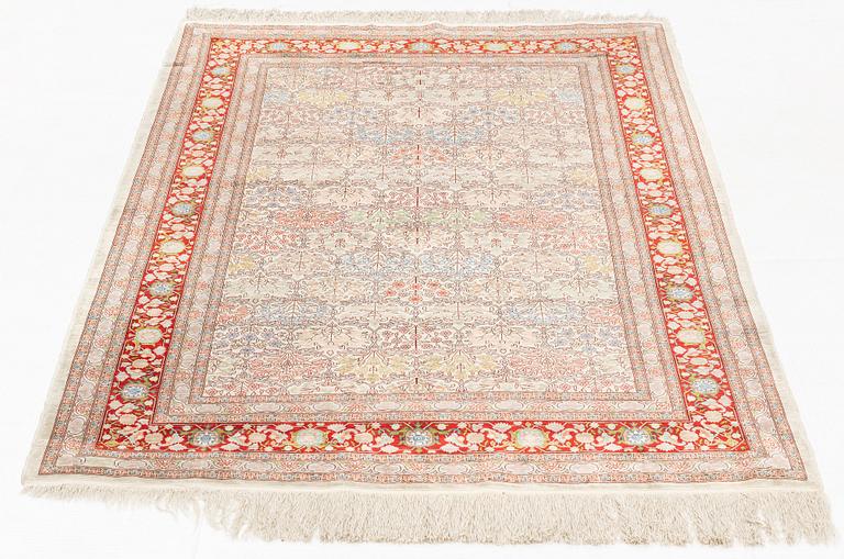 A rug, old, silk Hereke, signed, ca 166,5 x 109 cm.