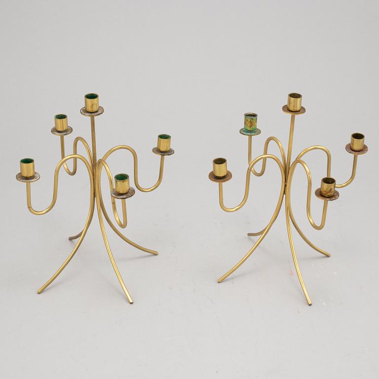 Gunnar Ander, a pair of five-light brass candelabra from Ystad Metall.