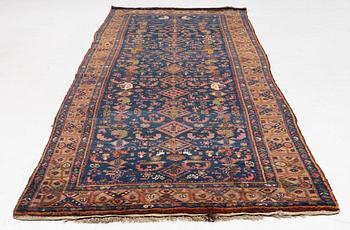 A semi-antique Northwest Persian runner, c. 388 x 94 cm.