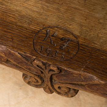 KNUT FJAESTAD, a folk art oak cabinet, signed KF 1935.