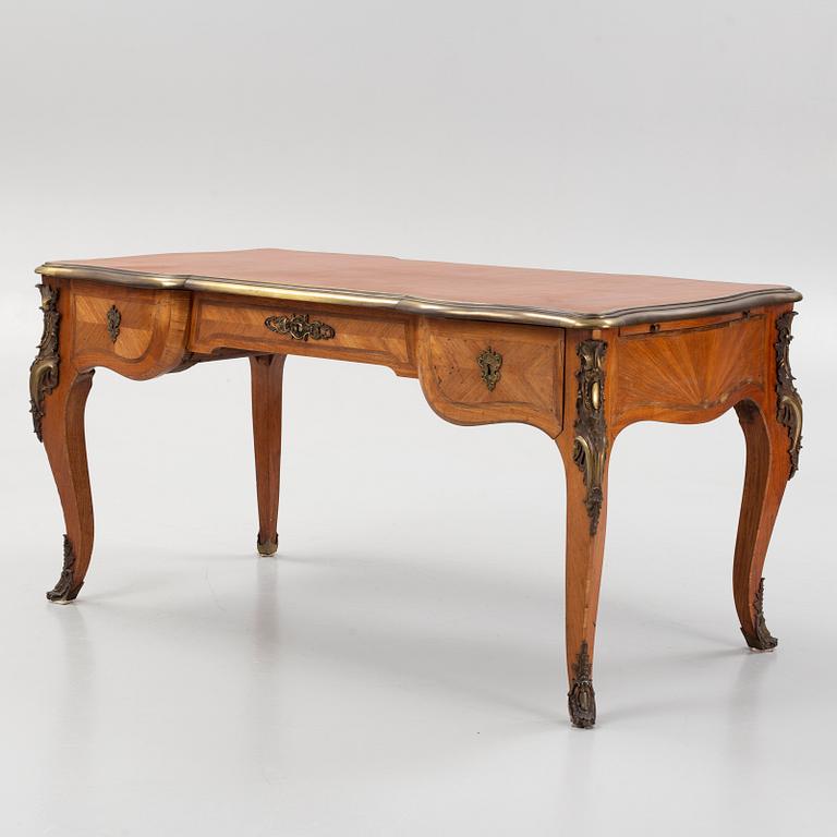 A French Louis XV-style parquetry and gilt bronze-mounted 'bureau plat', late 19th century.