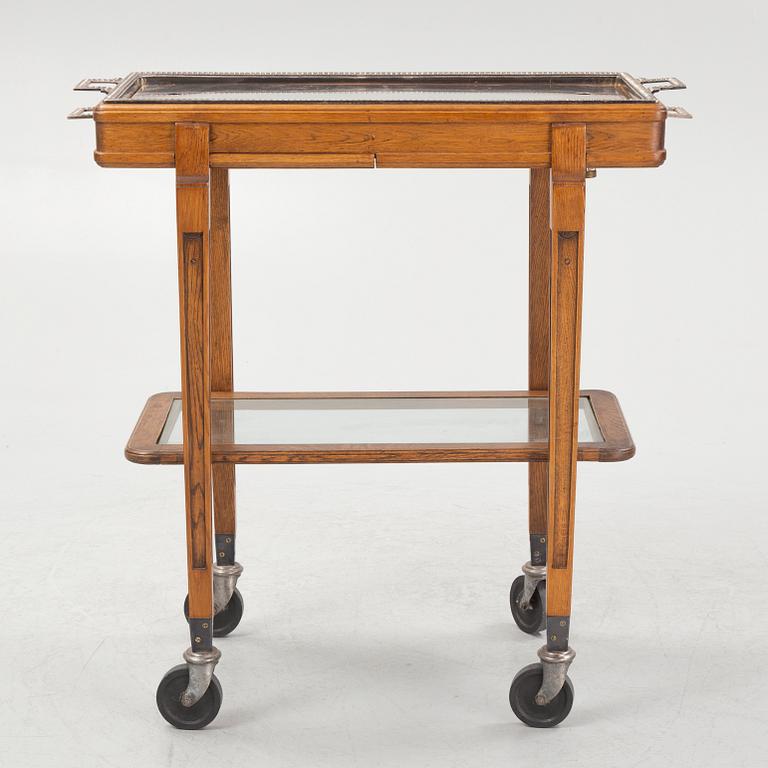 A restaurant serving trolley with silver plate dishes, first half of the/mid 20th century.