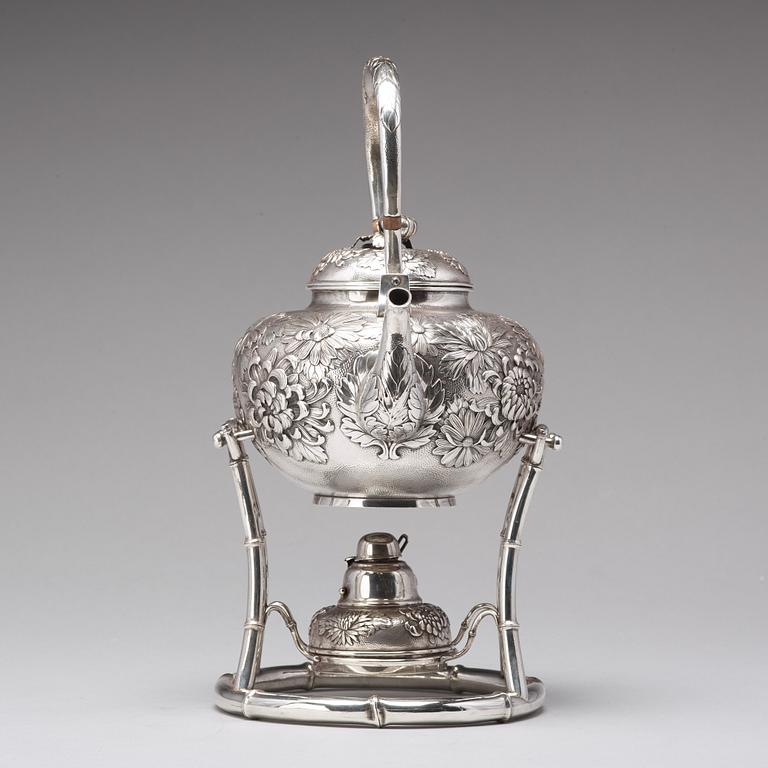 A Japanese silver tea pot with burner and stand, makers mark Samurai Shokai, Yokohama, Sterling.