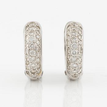 A pair of earrings in 18K white gold with round brilliant-cut diamonds.