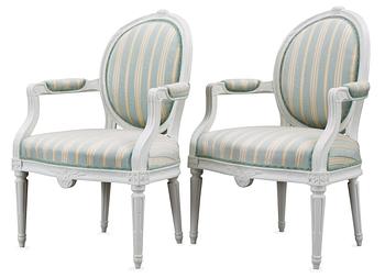 595. A pair of Gustavian late 18th Century armchairs.