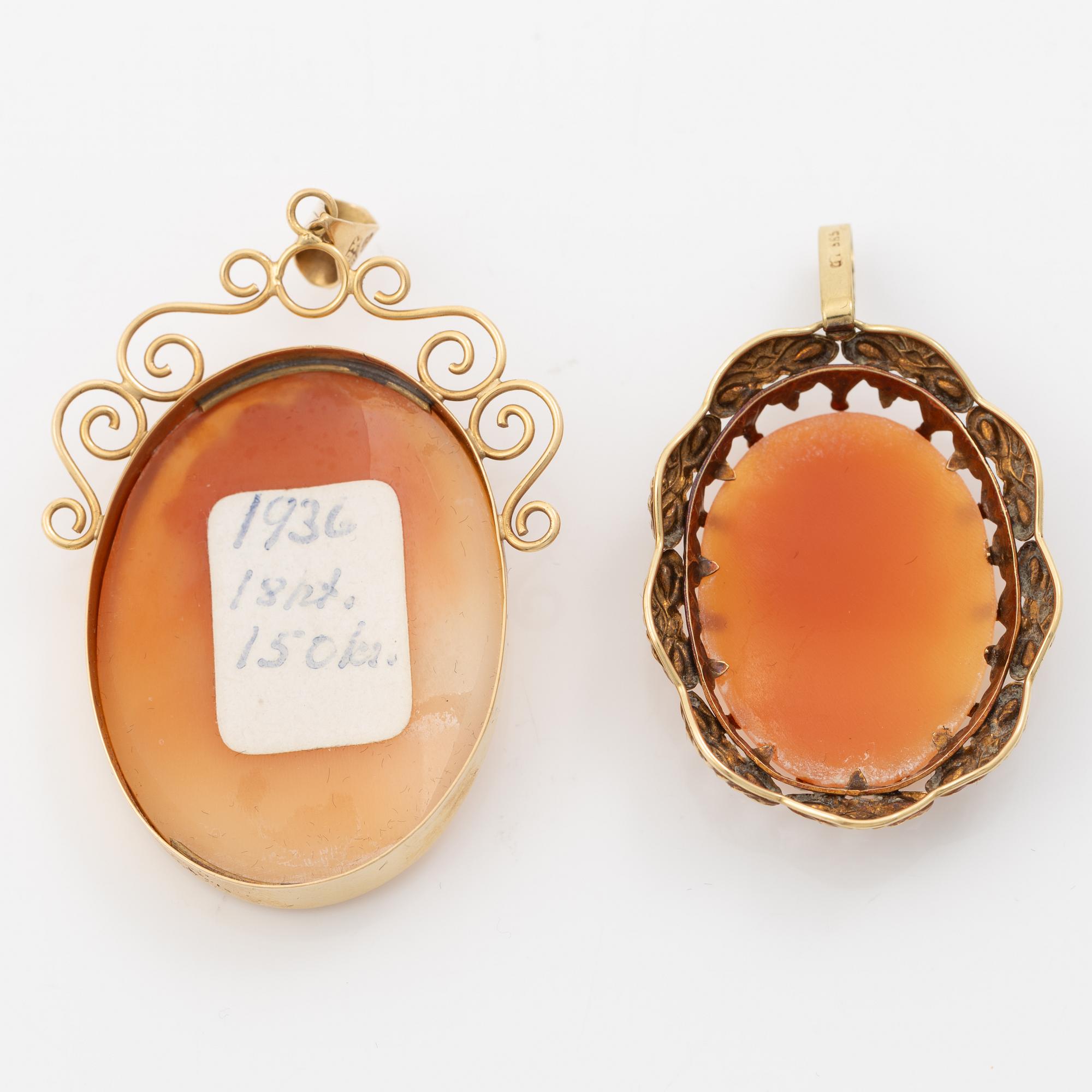 Two gold and shell cameo pendants.