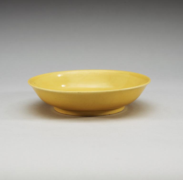 A yellow glazed dish, Ming dynasty with Zhengdes six character mark and of the period.