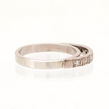 An 18K white gold ring set with round single cut dimamonds.