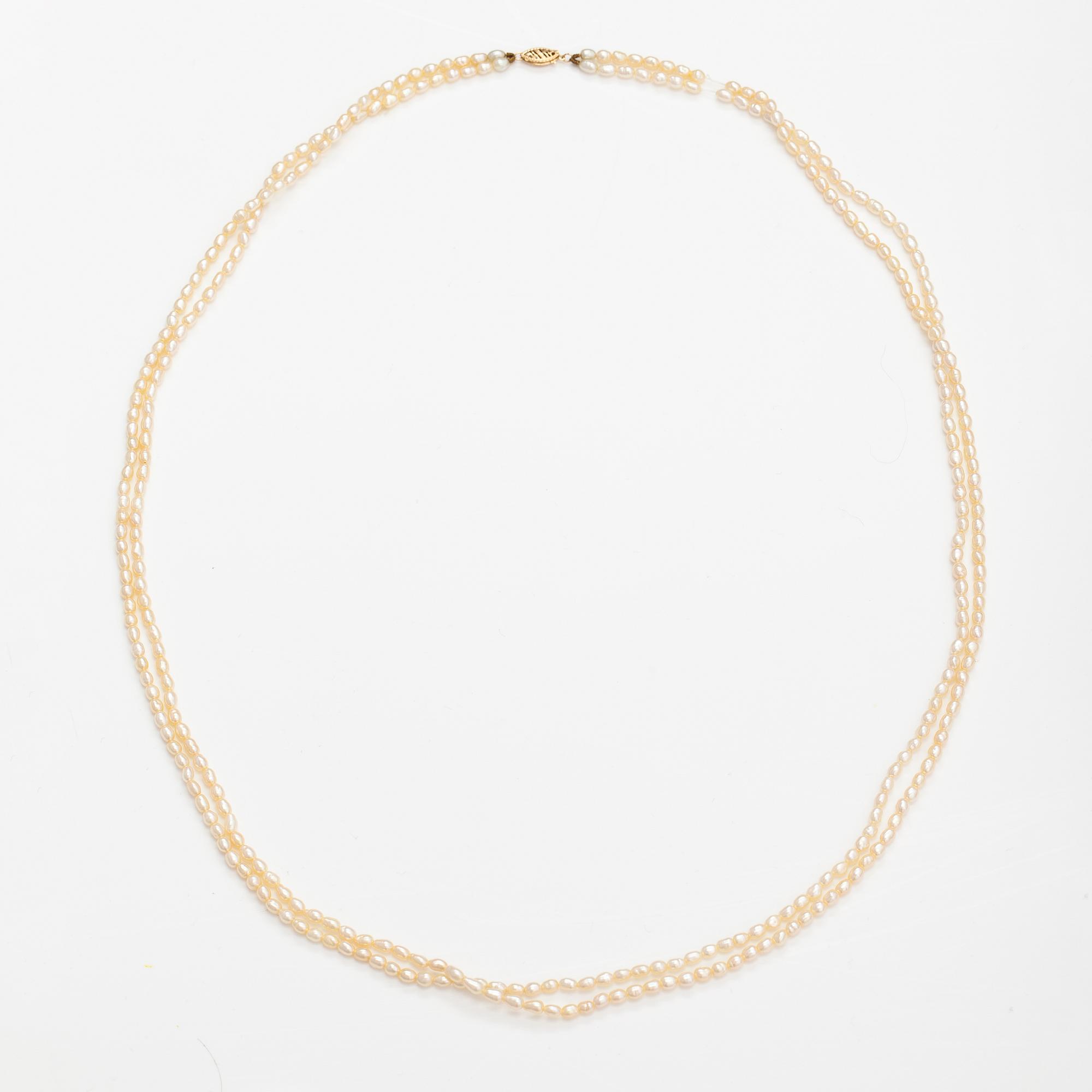 A two-strand pearl collier with cultured pearls and 14K gold clasp.