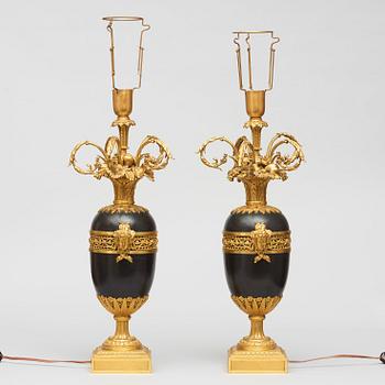 A pair of gilt and patinated bronze table lamps signed and dated by Henry Dasson 1877.